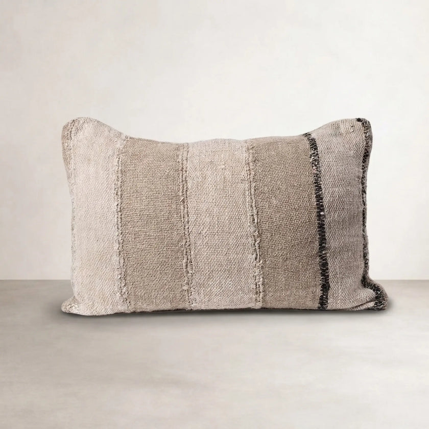 Retreat Linen Cushion — handwoven stripe fabric with a feather insert holding its shape