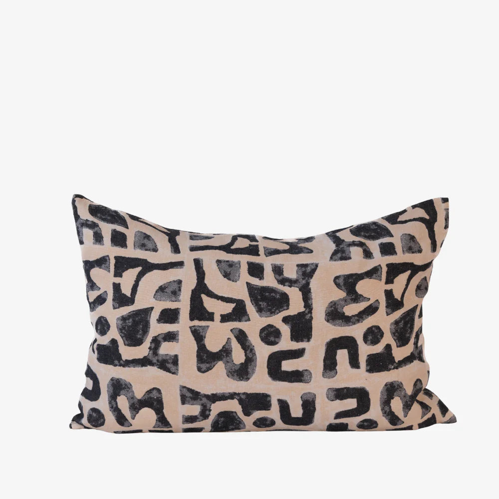 Abstract black print cushion on nude linen, rectangular decorative cushion