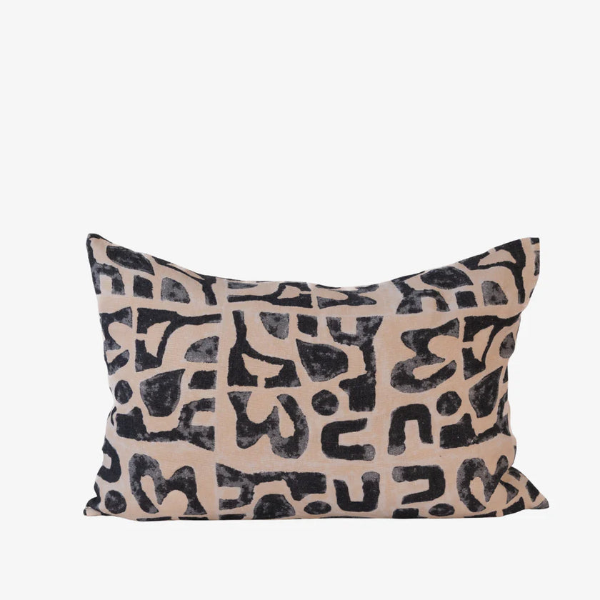 Abstract black print cushion on nude linen, rectangular decorative cushion