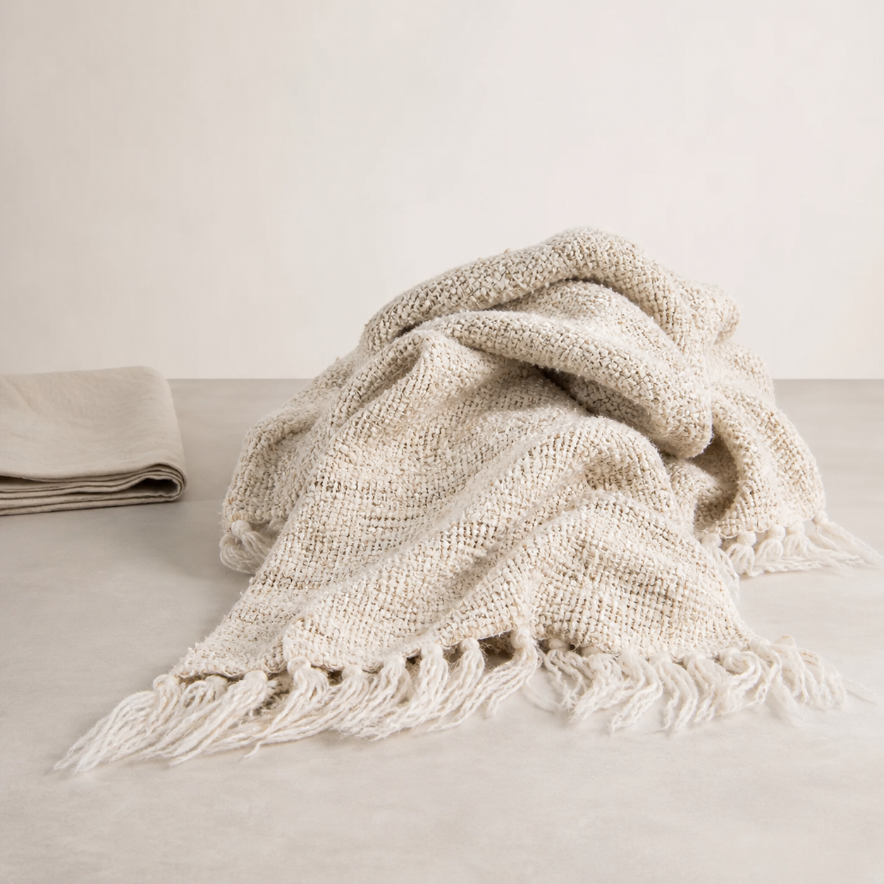 Wabi Throw — open irregular weave in soft ivory