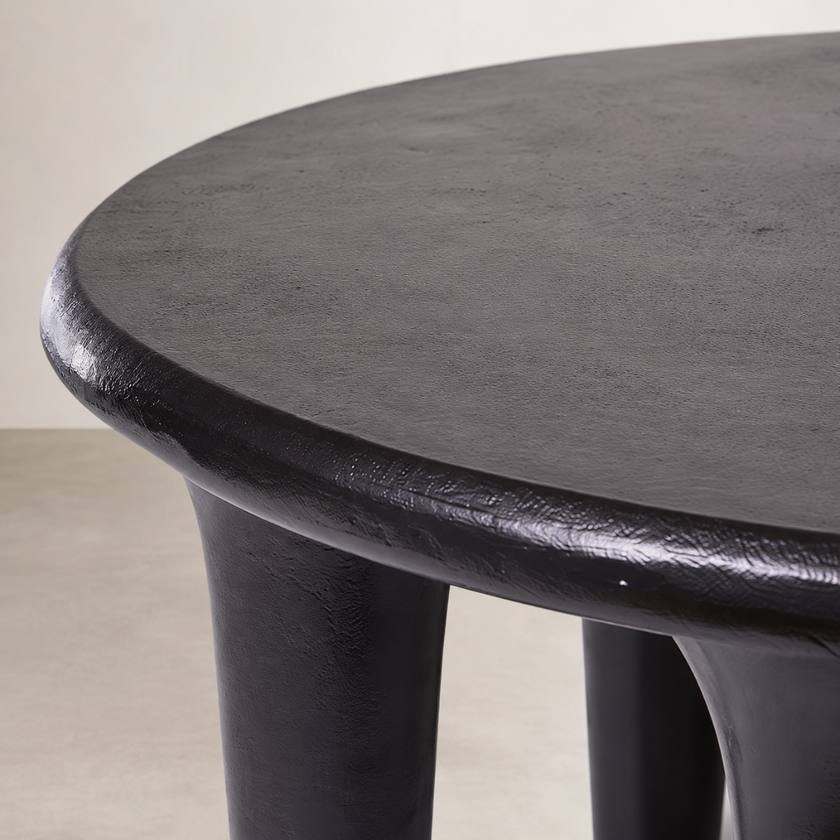 Mesa Coffee Table — matte black surface taking in the light