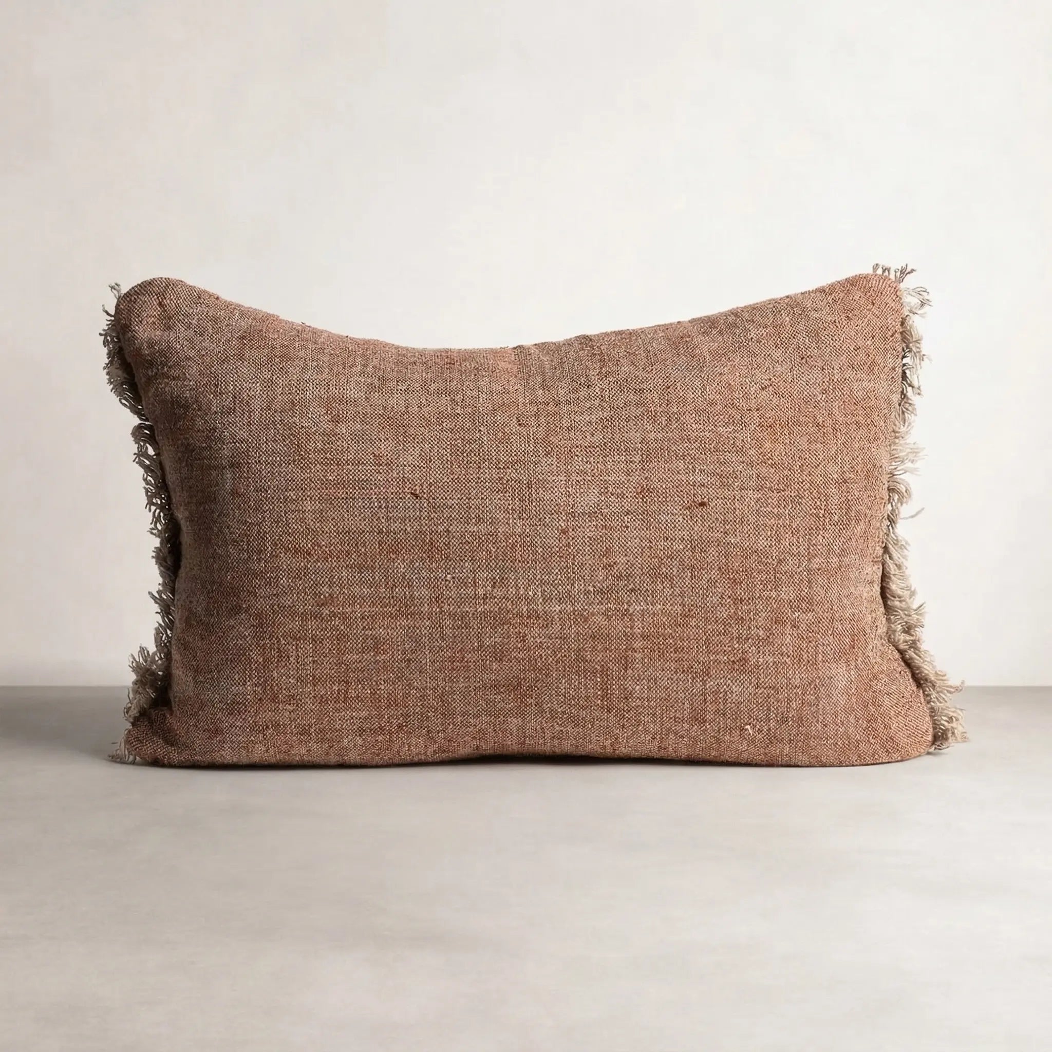 Tabako Linen Cushion — rectangular lumbar cushion in tobacco linen with frayed fringe