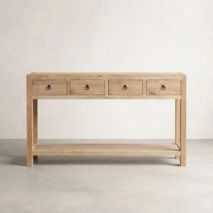 Wooden console table with four drawers on a plain background