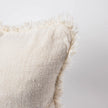 Coastalis Living + Design Bedouin Handwoven Linen Cushion in Ivory side angle with fringed edges