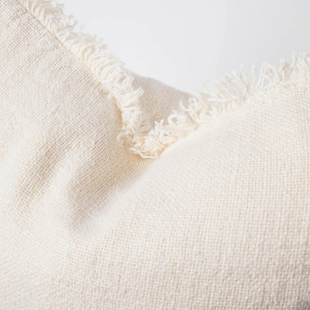 Coastalis Living + Design Bedouin Handwoven Linen Cushion in Ivory close-up texture with frayed edge