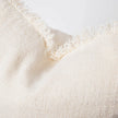 Coastalis Living + Design Bedouin Handwoven Linen Cushion in Ivory close-up texture with frayed edge