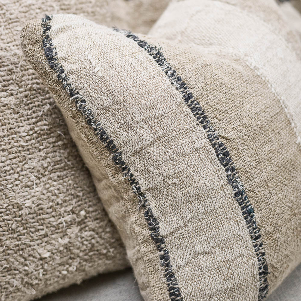 Retreat Linen Cushion — understated stripe reading as texture across the linen