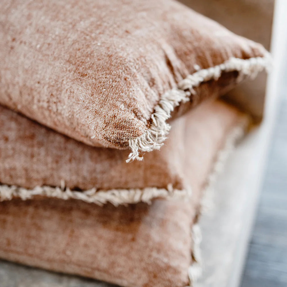Tabako Linen Cushion — yarn-dyed tobacco linen with natural frayed edging
