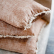 Tabako Linen Cushion — yarn-dyed tobacco linen with natural frayed edging
