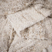 Wabi Throw — ivory reclaimed linen holding its chunky shape