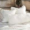 Coastalis Living + Design Bedouin Linen Cushions in Ivory styled on bed with white linen bedding