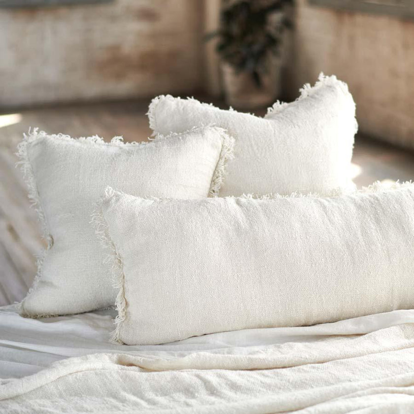 Coastalis Living + Design Bedouin Linen Cushions in Ivory styled on bed with white linen bedding