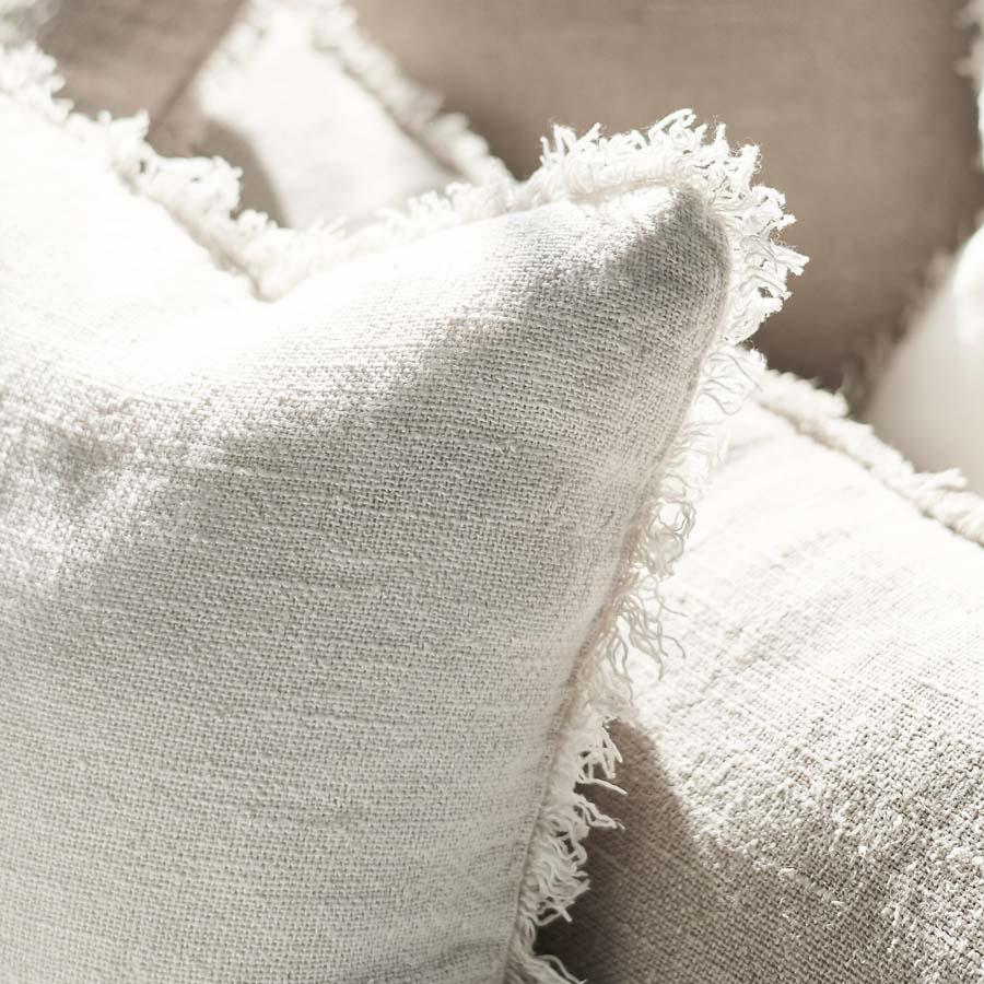 Coastalis Living + Design Bedouin Cushion in Ivory close-up of rustic linen weave and fringed edge detail