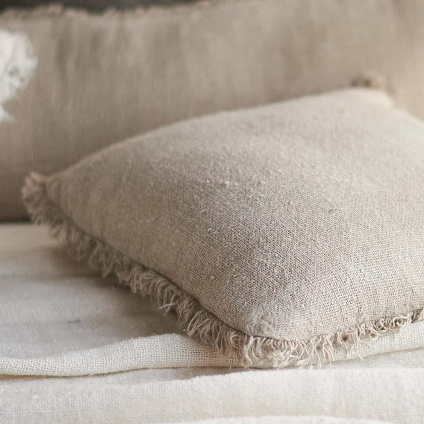 Coastalis Living + Design Bedouin Linen Cushion in Ivory with frayed fringe edge detail