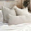 Coastalis Living + Design Bedouin Linen Cushions in Natural styled on bed with white linen bedding