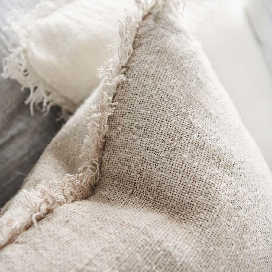 Coastalis Living + Design Bedouin Cushion in Natural, close-up of rustic linen weave and fringed edge