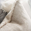 Coastalis Living + Design Bedouin Cushion in Natural, close-up of rustic linen weave and fringed edge