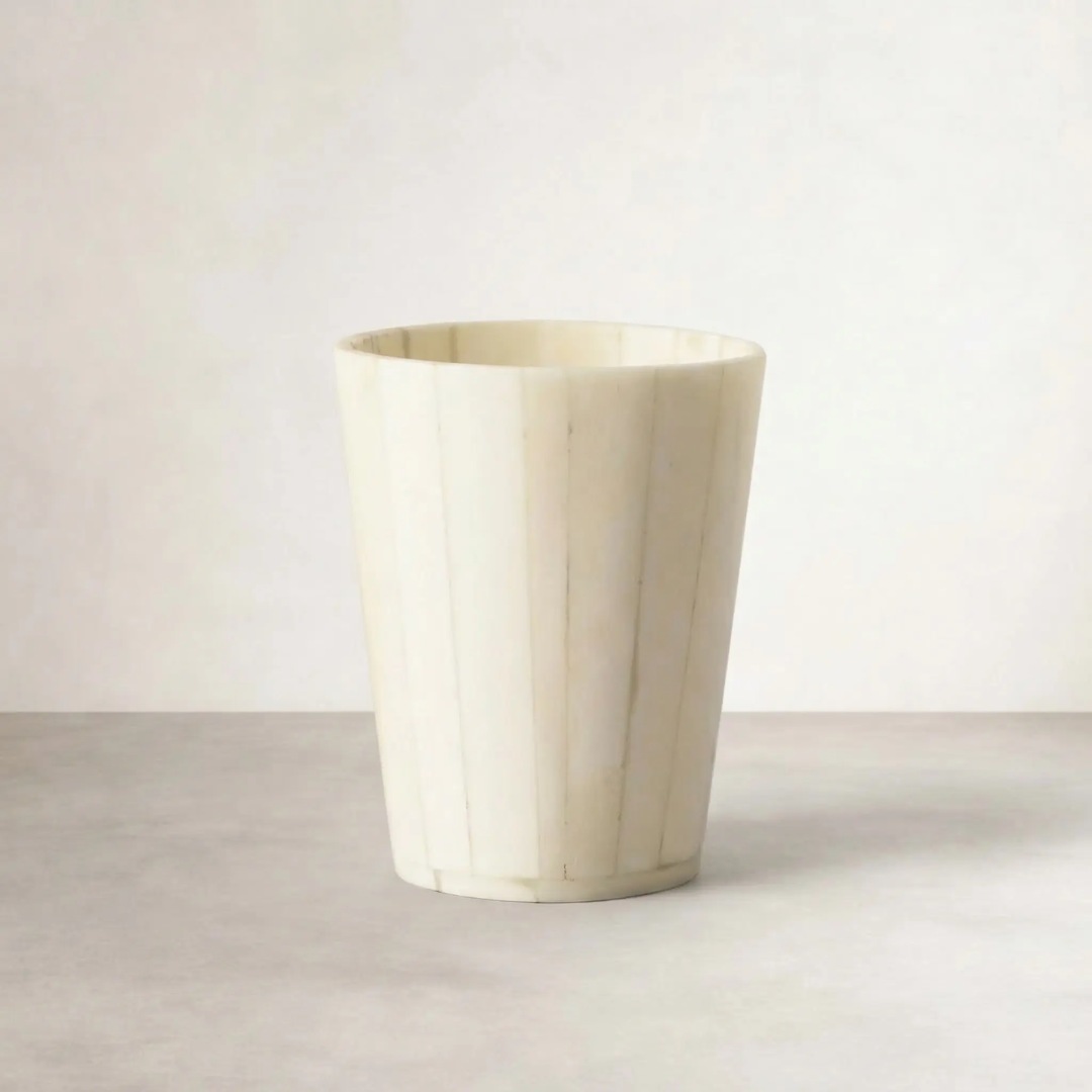 Inlaid bone vase, front view on neutral background showing vertical bone inlay strips
