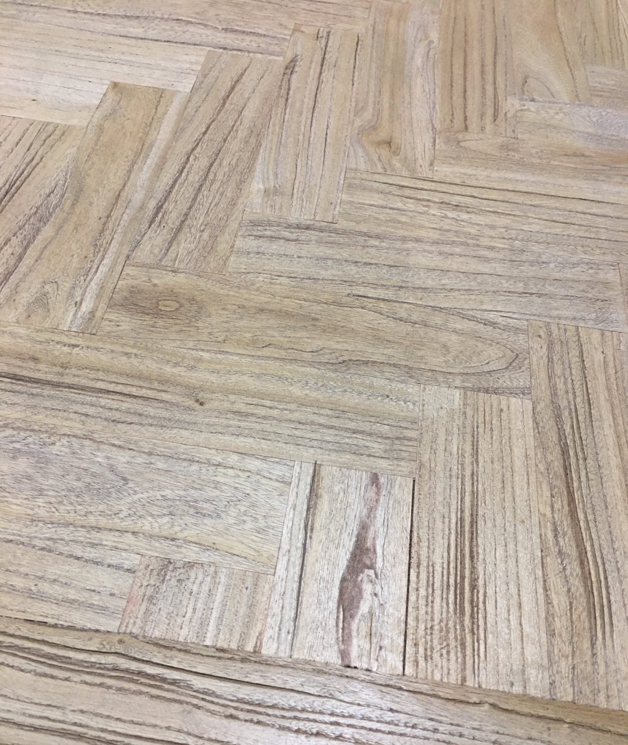 Cinquant Reclaimed Elm Coffee Table — close detail of the herringbone reclaimed elm top