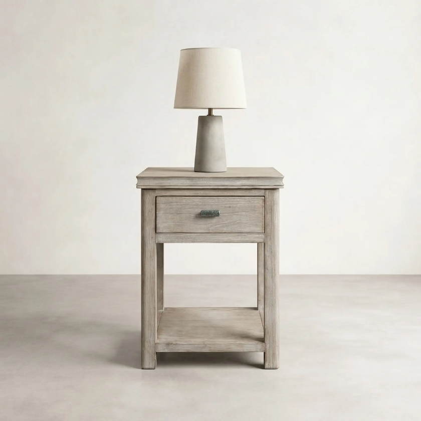Modena TS050 one-drawer bedside cabinet in light timber styled with a table lamp
