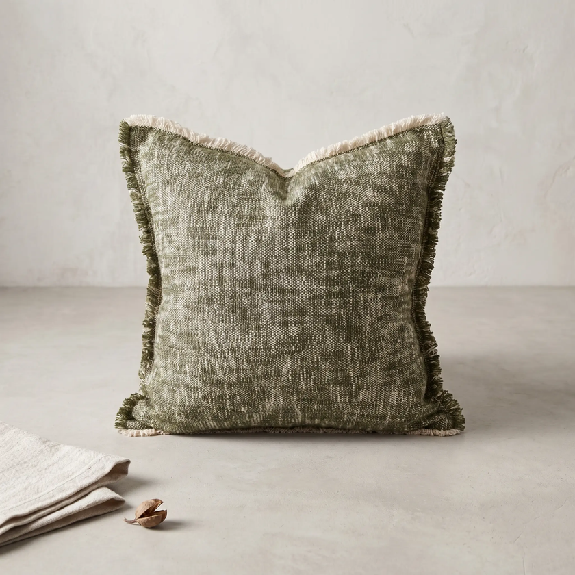 Sero Cotton Cushion — irregular slubbing alive across the olive weave