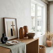 Tutsi Milk Jug Vintage — graphic silver line against irregular wood grain
