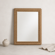 Anda Wall Mirror — continuous fluted ridges around all four sides