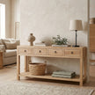 Wooden console table in a living room with decor items
