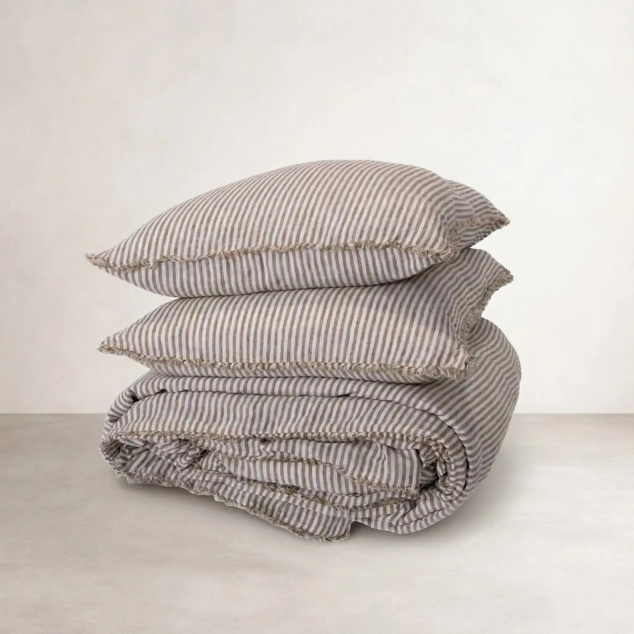 Coastalis Living + Design French Linen Pillowcase and Quilt Cover stack in Olive Pencil Stripe
