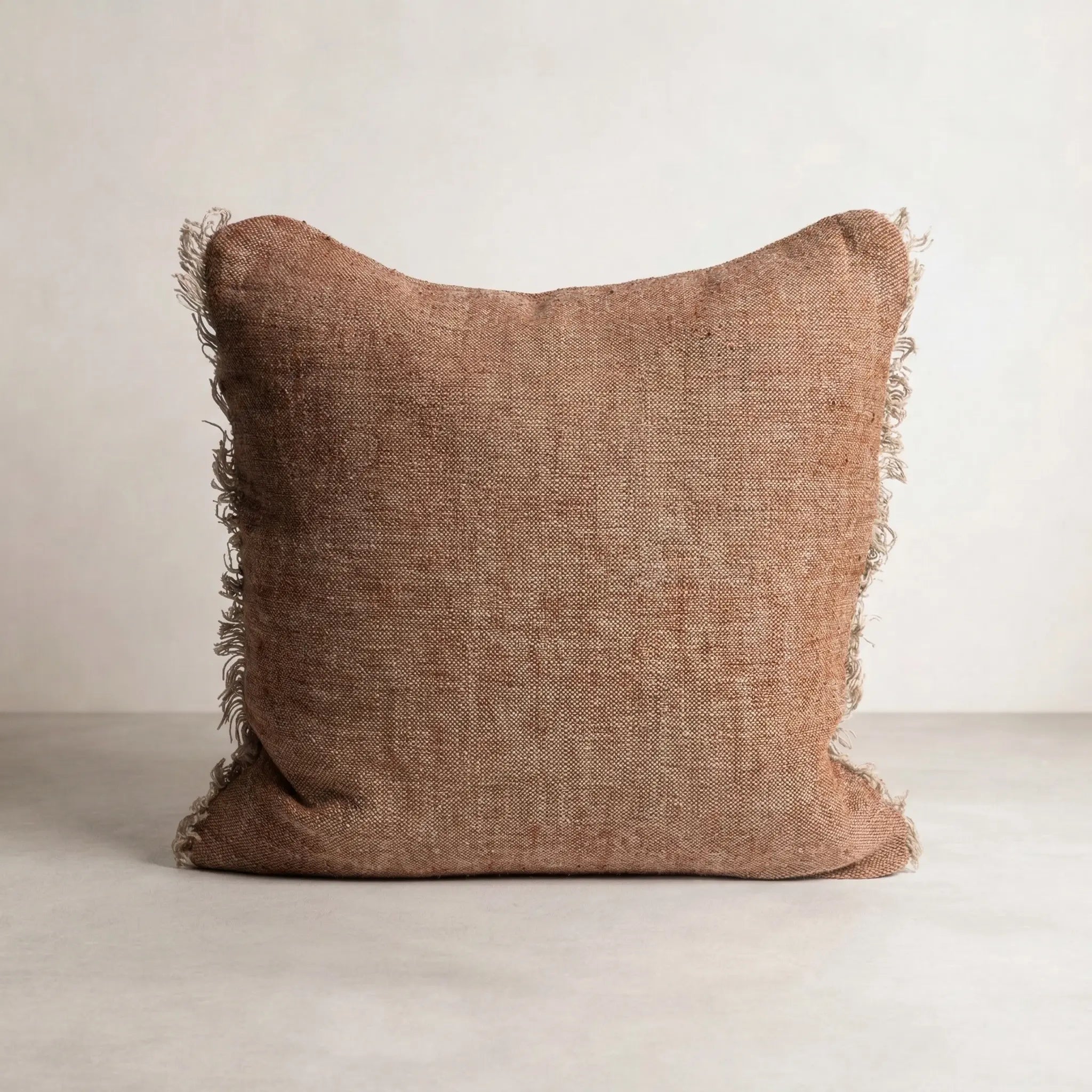 Tabako Linen Cushion — square cushion in textured tobacco linen with frayed fringe