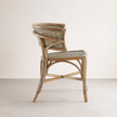 Cana Dining Chair — wrap-around curved back in plantation rattan
