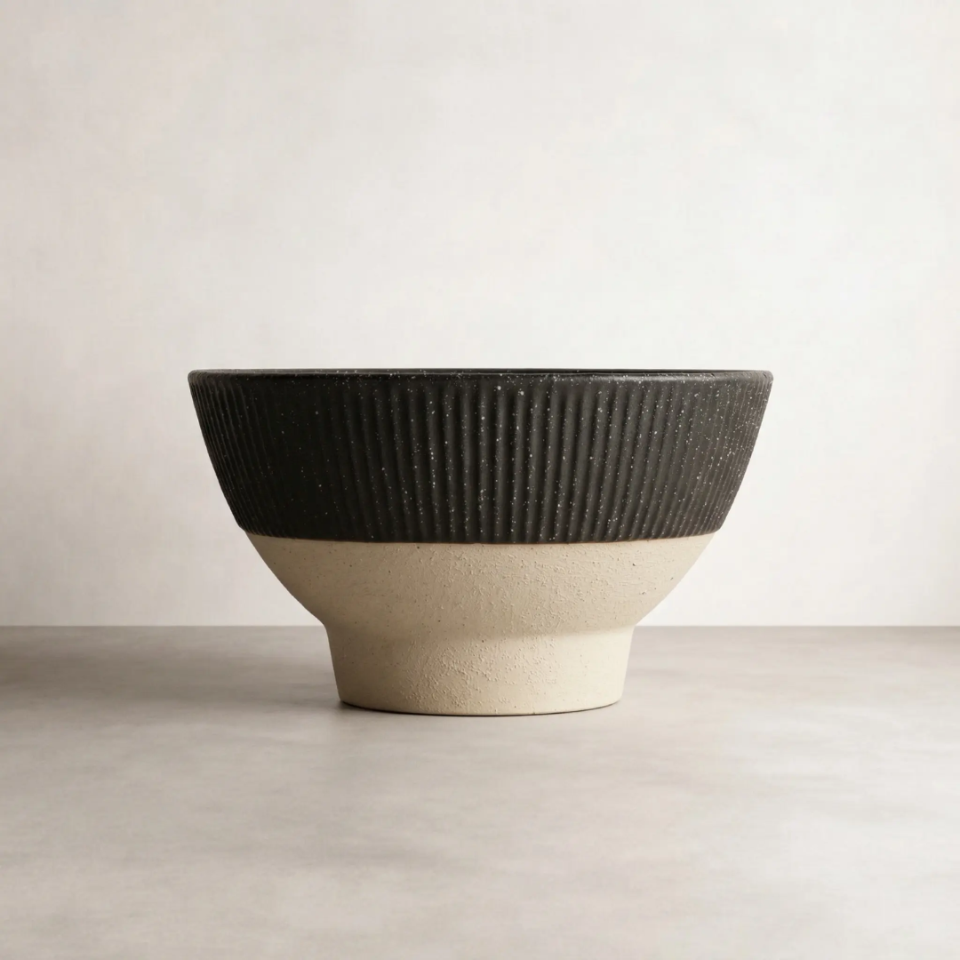 Eko Ceramic Bowl — wide low bowl in solid black ceramic with a matte-to-satin finish
