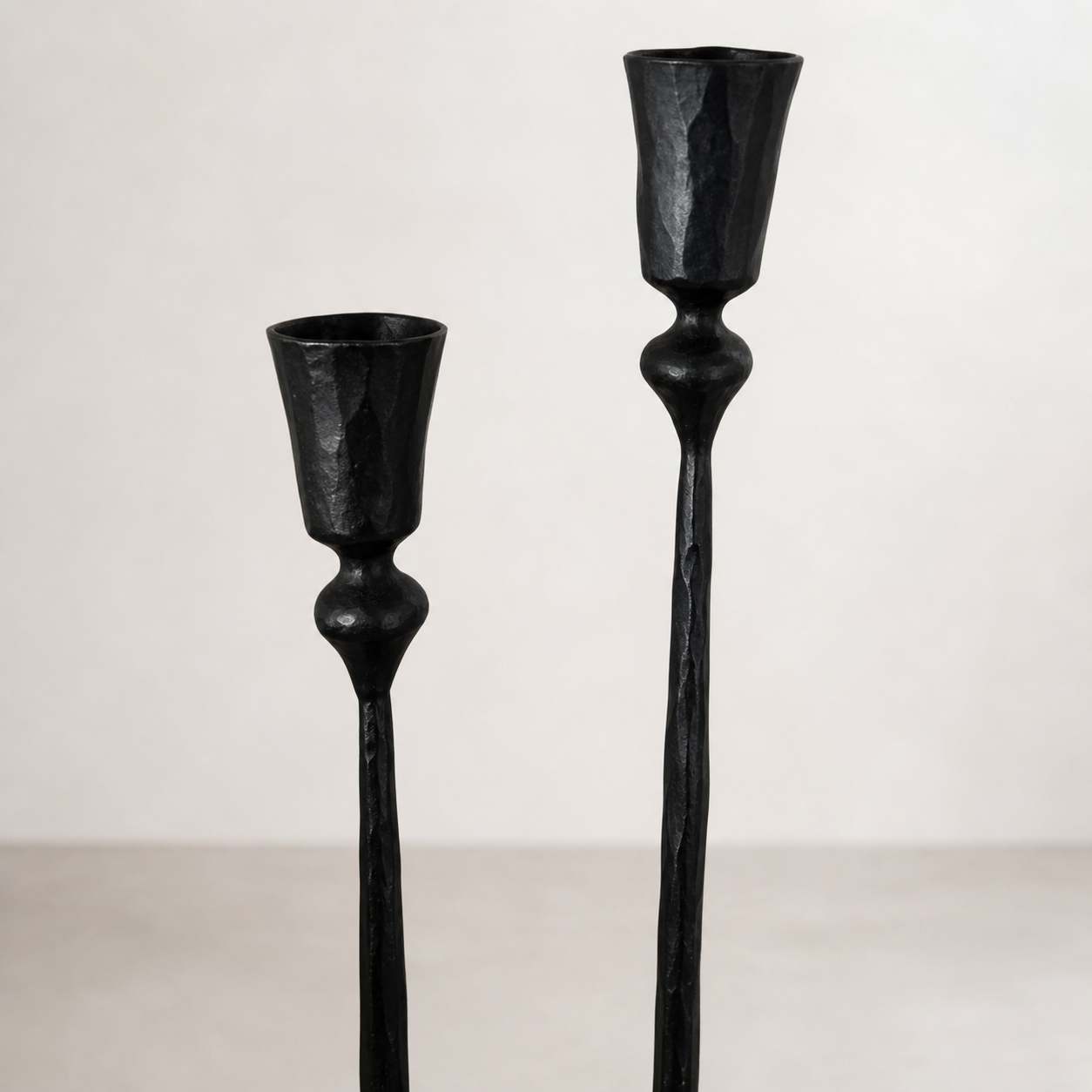 Nyx Forged Iron Candle Stands — close-up of the hand-forged iron surface
