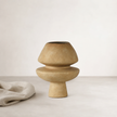 Dori Vessel - Clay — flared plinth base beneath a rounded cap