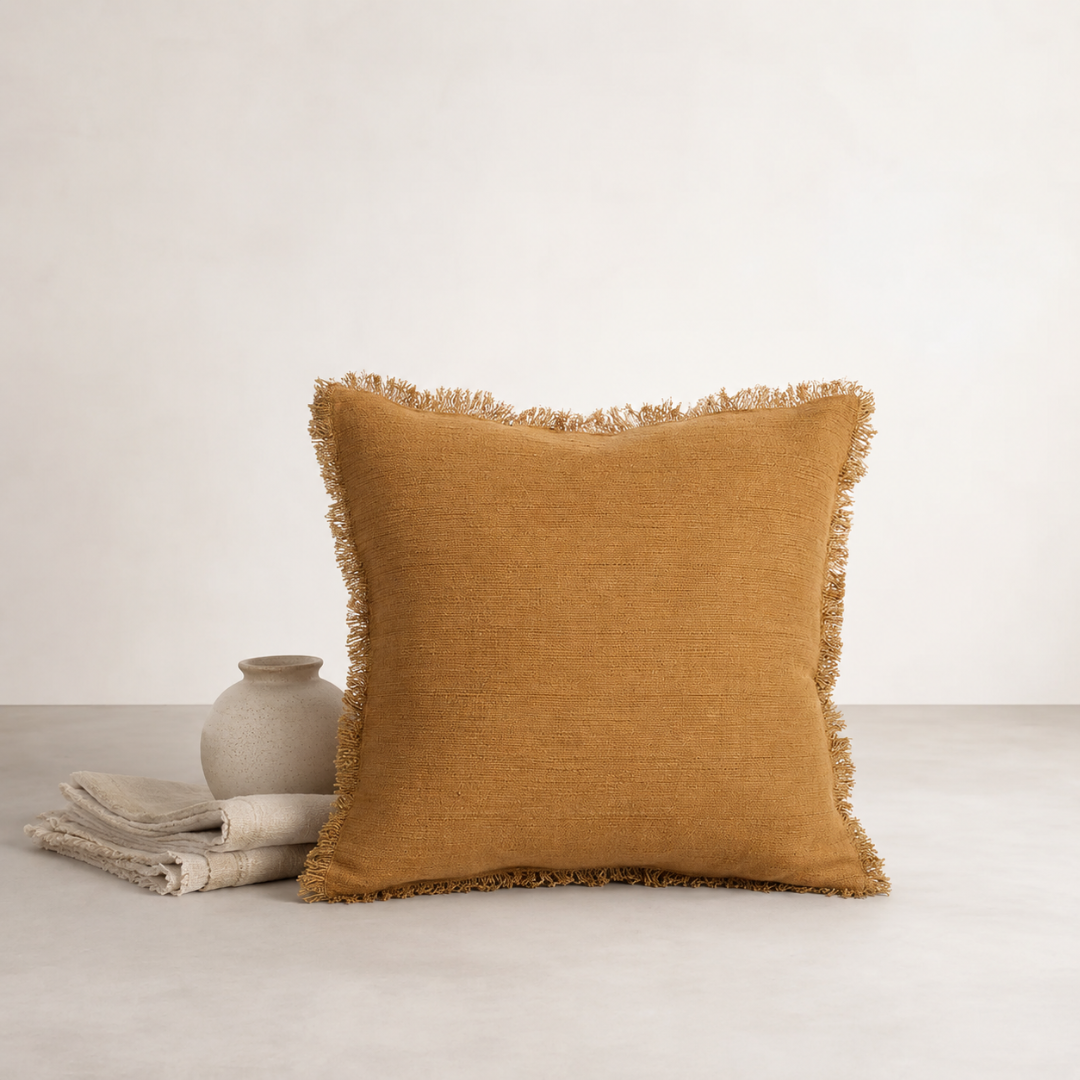 Eli Cushion - Toffee — horizontal ribbed weave catching light in narrow bands