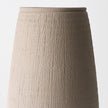 Sola Pot — hand-finished clay vessel with fine vertical cross-hatching