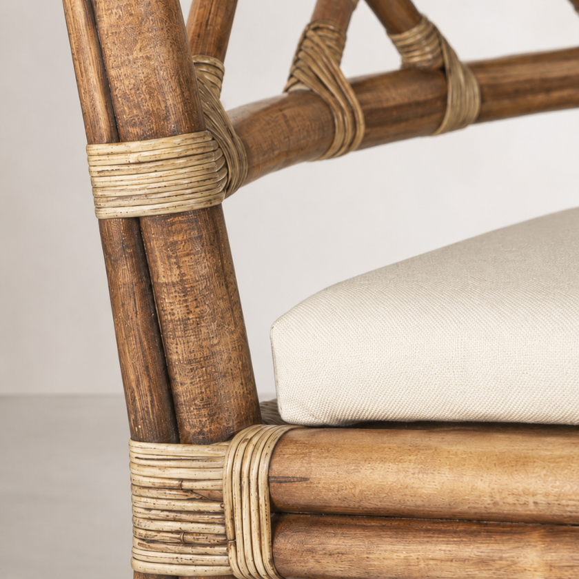 Nido Dining Chair — handcrafted rattan chair in a warm natural tone