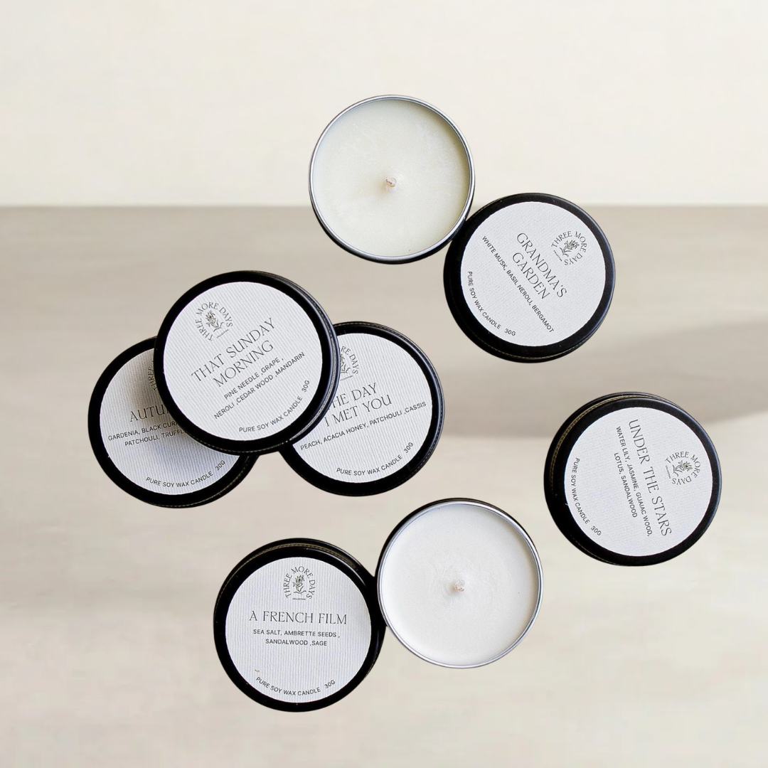Discovery Set — eight mini soy candle tins with wooden wicks in assorted fragrances
