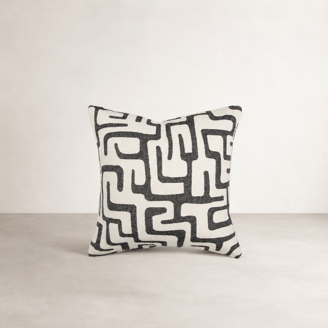 Toma Cushion — Black — hand-drawn jacquard marks on a deep black ground