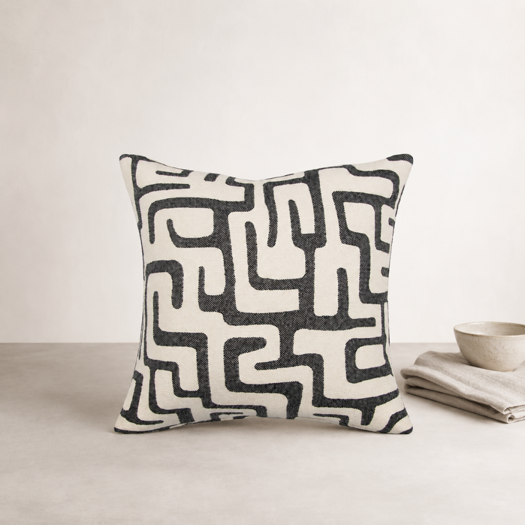 Toma Cushion — Black — irregular graphic pattern sitting in soft relief