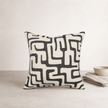 Toma Cushion — Black — irregular graphic pattern sitting in soft relief