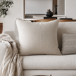 Una Cushion - Natural — natural weave sitting between ecru and oat